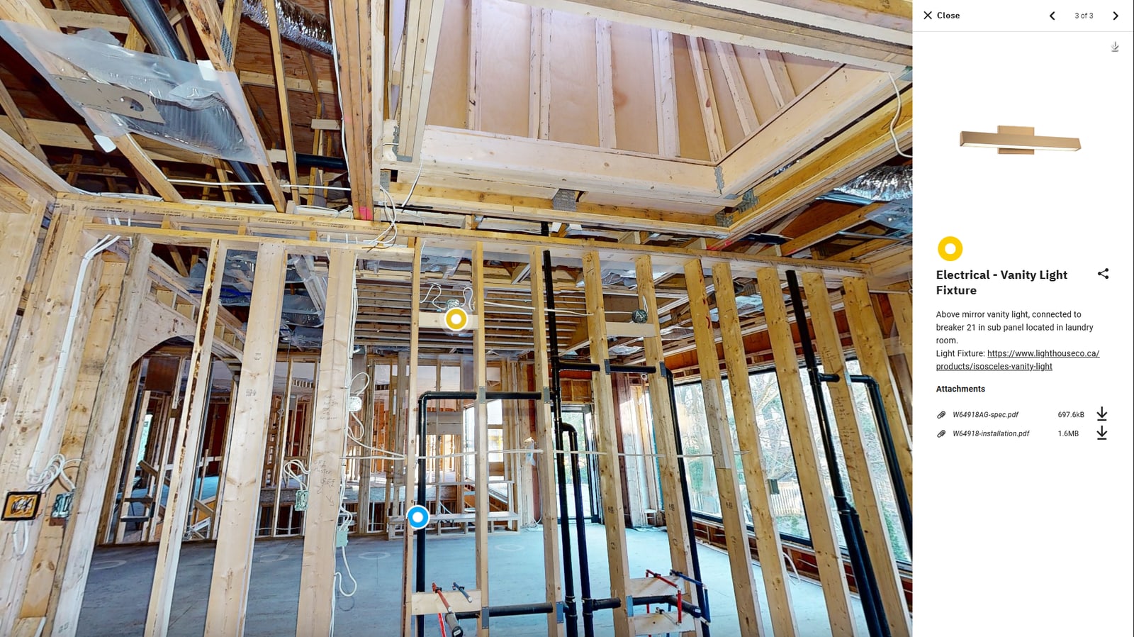The full-tour view of a construction scan with a tag panel open on the right — the framing visible in the background and the Electrical Vanity Light Fixture details visible alongside