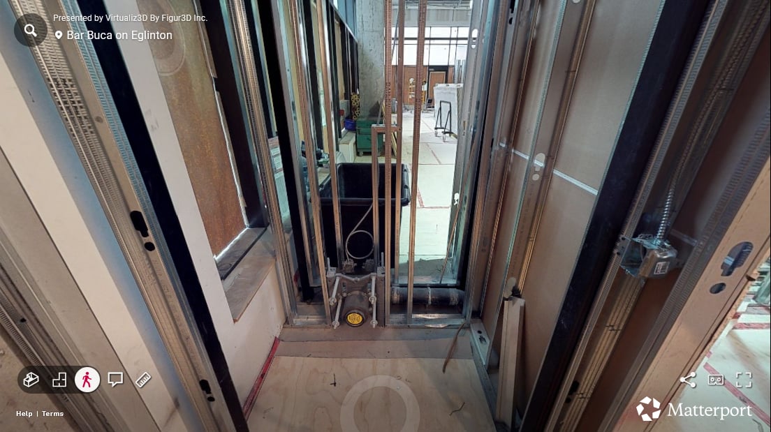 Bar Buca bathroom in the first progress scan — open framing and rough plumbing